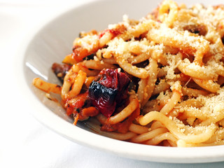 Italian Food - Pici pasta with grilled vegetables, a typical kind of pasta in Tuscany, Italy.