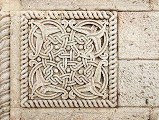 Closeup of architectural ornament. Stone carving of flower motif