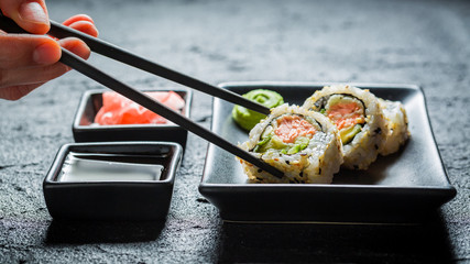 Delicious California Maki sushi made of salmon and avocado © shaiith