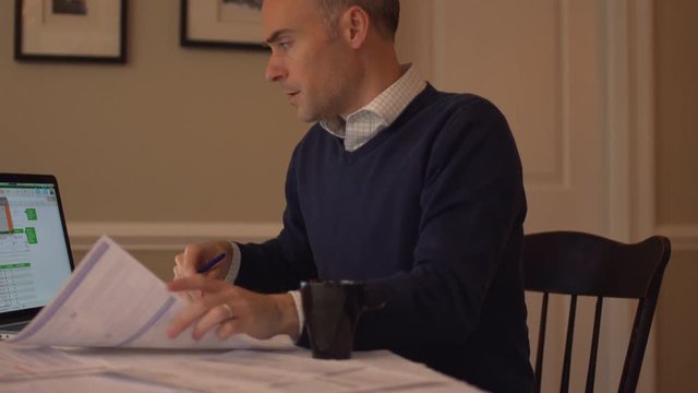 a man balancing his checkbook