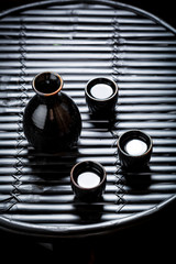 Ready to drink sake in Asian restaurant on black table