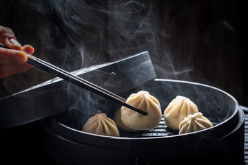 Yummy and hot chinese dumplings in bamboo steamer