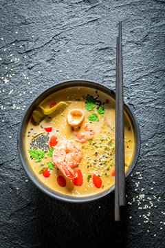 Delicious Tom Yum soup with shrimps and coconut milk