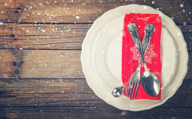 Christmas and New Year Holiday Table Setting Celebration Place setting for Dinner Decorations.Toned image.Vintage style.  top view. Copy space. selective focus.