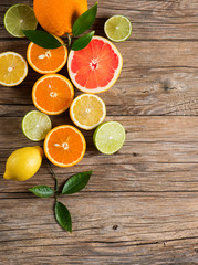 Fototapeta na wymiar Mix of fresh citrus fruits, above view.