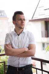 man standing at balcony