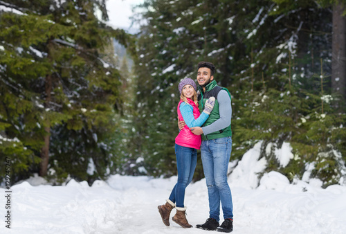 Young Mix Race Couple Embrace Snow Forest Outdoor Winter Walk Pine
