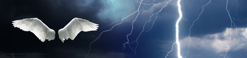Angel wings with sky background showing lightning, stormy sky and clouds