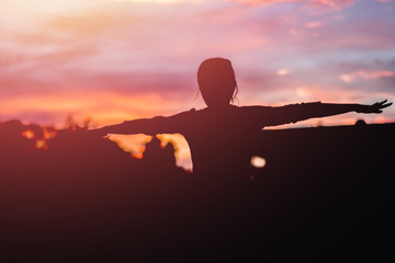 Silhouette beautiful woman yoga on sunset. Sunset sky background.