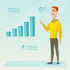Fototapeta premium Successful businessman pointing at chart going up.