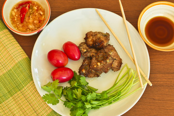 Tasty roasted pork with fresh vegetable and Thai style sauce