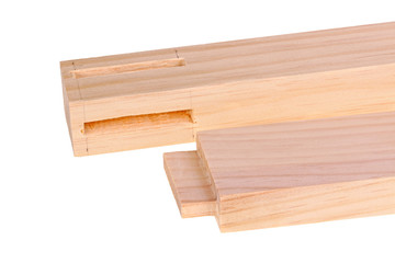 Close-up of boards with a woodworking mortises and a tenon isola