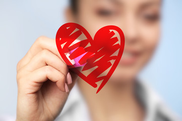 Cardiologist drawing heart, closeup. Cardiology concept.