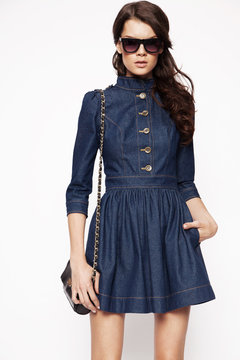 Woman in jeans short dress and sunglasses 