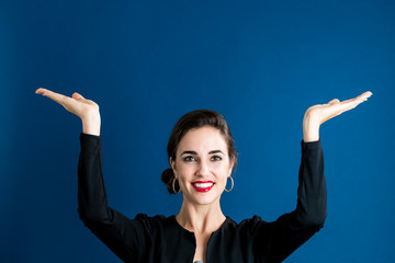 Woman reaching and looking upwards