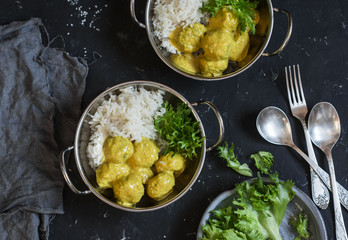 Vegetarian quinoa and broccoli meatballs with curry sauce and rice. Vegetarian lunch table, top view