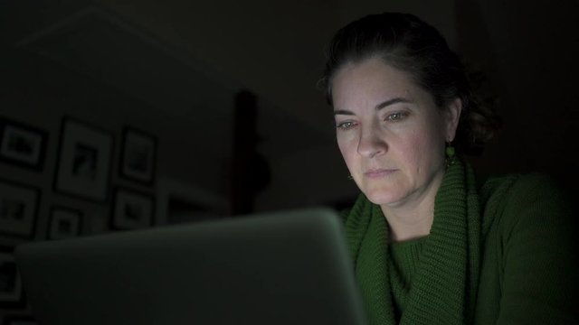 a woman reading the news on the internet