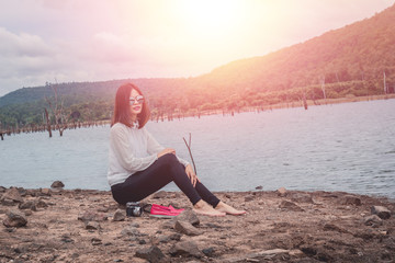 Fototapeta premium Lifestyle portrait of pretty young hipster woman making photo on