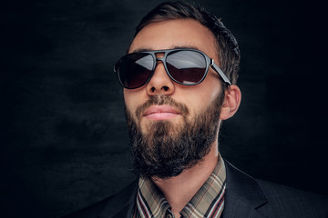 Fototapeta premium Close up portrait of bearded male in sunglasses.