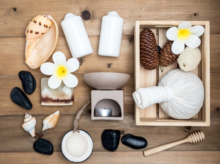 Obraz na płótnie Canvas Aromatherapy product Spa set ,candle ,soap,coconut, massage with white wood background. top view,flat lay composition.