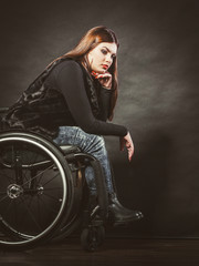 Fototapeta na wymiar Sad girl on wheelchair