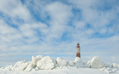 Winter Lighthouse. The Lighthouse island in the winter on the Ladoga Lake. Suho Island. Russia.