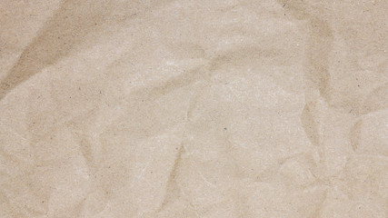 Recycled crumpled brown paper texture or paper background for design with copy space for text or image.