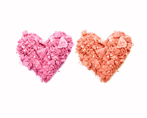 Heart shape of crushed eyeshadow isolated on white