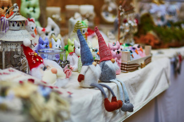 Funny handmade little gnomes on market