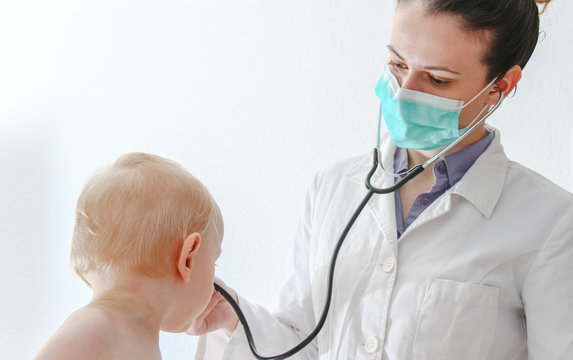 One Year Old Sick Baby Boy At The Young Female Doctor