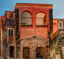 Beautiful view of colorful facades of old houses in Italy. Architectural background.