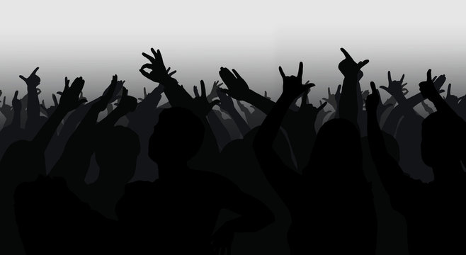 Silhouettes of crowd with hands raised
