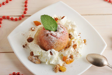 fruit dessert - baked Apple with icing sugar on plate