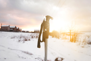 Ski poles on the background of a bright sunset