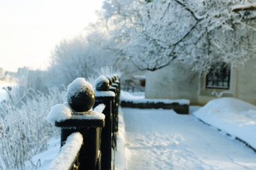 fence covered snow winter park