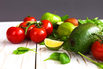 Spinach, lime, avocado, cherry tomatoes,  and apple
