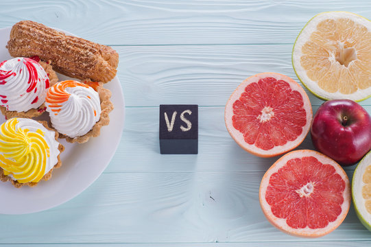 Choosing between Fruits and Sweets. Healthy versus unhealthy food. Weight Loss. Unhealthy tempting cakes and healthy fruits