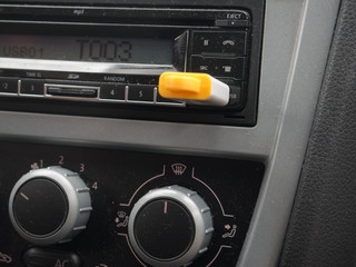 Fototapeta premium Stereo car plugs conssole with USB stick inserted.