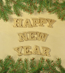 Happy New Year golden text and spruce branch