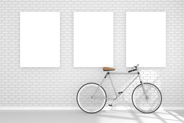 3D rendering : illustration of three white poster hanging on the wall.space for your text and picture.display template.white brick wall and wooden floor.light shining.bicycle