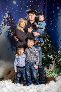 Winter family, group portrait of happy family at winter time
