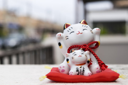 Maneki-neko is a common Japanese figurine (beckoning cat)