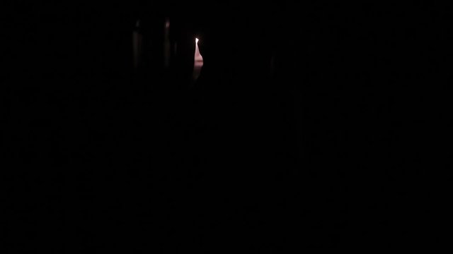 female legs in high heels are on the dark corridor
