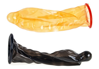 Two condoms on white background, ready to use