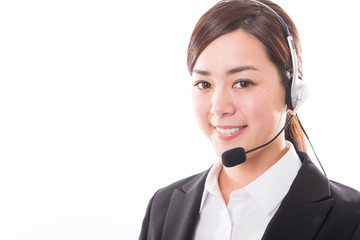 Young female customer service operator with headset and smiling