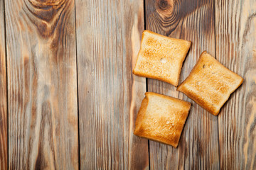 Fototapeta na wymiar Toast on a rustic wooden background