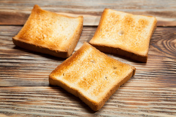 Toast on a rustic wooden background