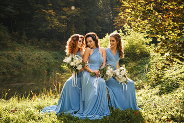 Three beautiful bridesmaids - obrazy, fototapety, plakaty