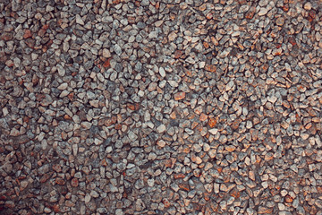 Gray small granite stone floor background. Stone rubble background.