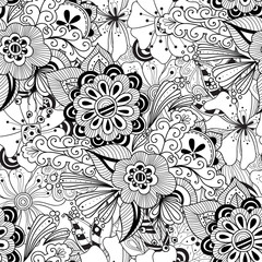 Naklejka premium Doodle flowers seamless pattern. Zentangle style flowers and leaves background. Black and white hand drawn herbal pattern. 